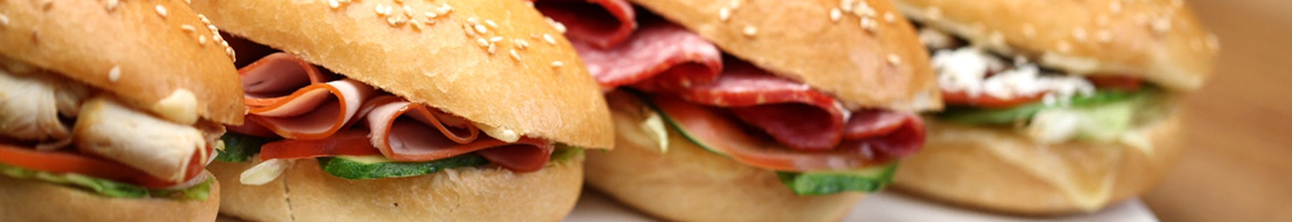 Eating Pizza Sandwich at Andalus Pizza & Cafe restaurant in Brighton, MA.